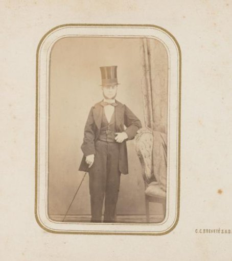 Portrait of a man with a tall hat and walking stick