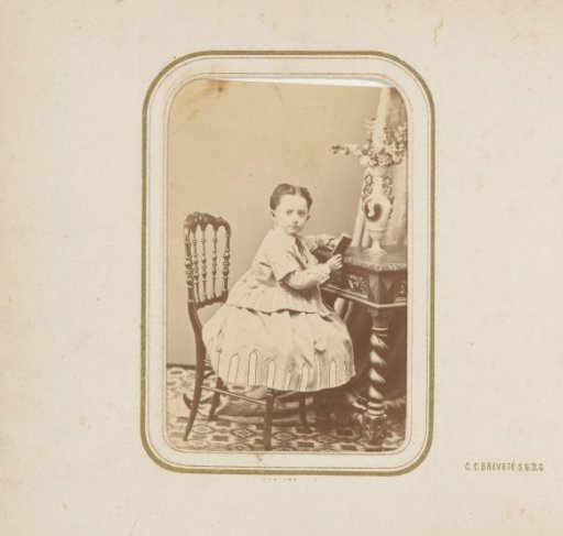 Portrait of a girl sitting at a table