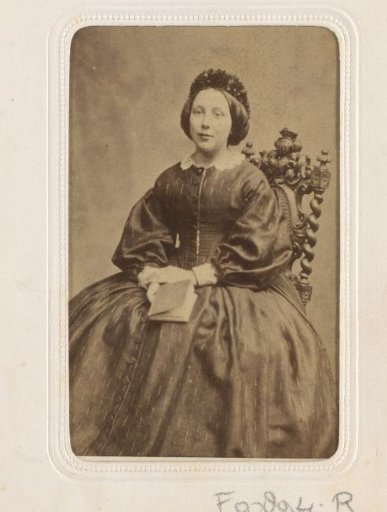 Portrait of a seated woman with a book in her hand