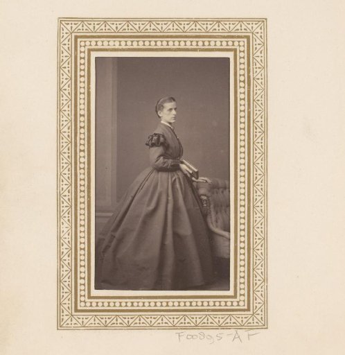 Portrait of a standing woman holding a book
