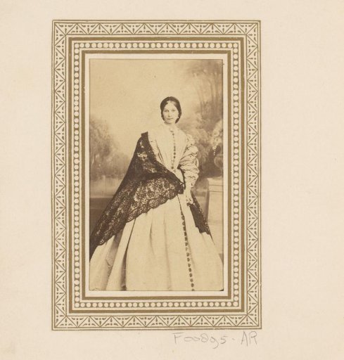 Portrait of a standing woman with a shawl