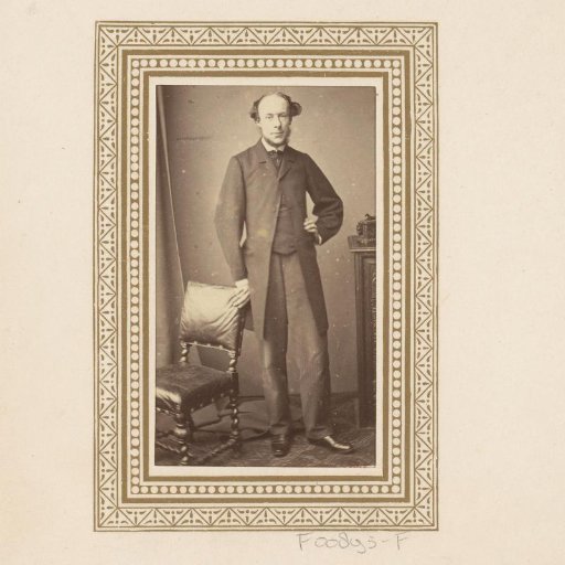 Portrait of a standing man with a beard
