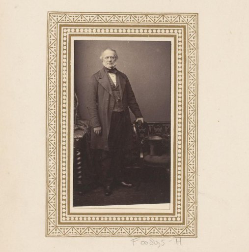 Portrait of a standing man with sideburns