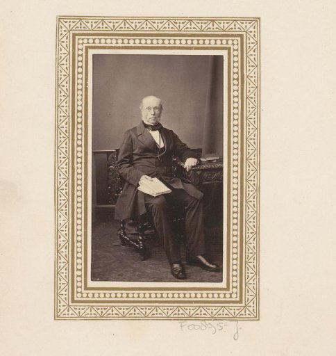 Portrait of a seated man with a newspaper
