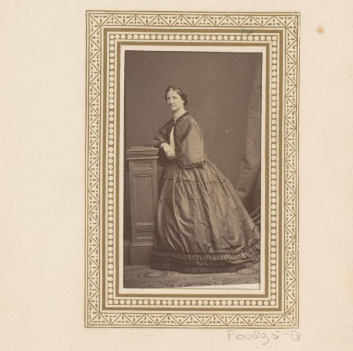 Portrait of a standing woman by a balustrade