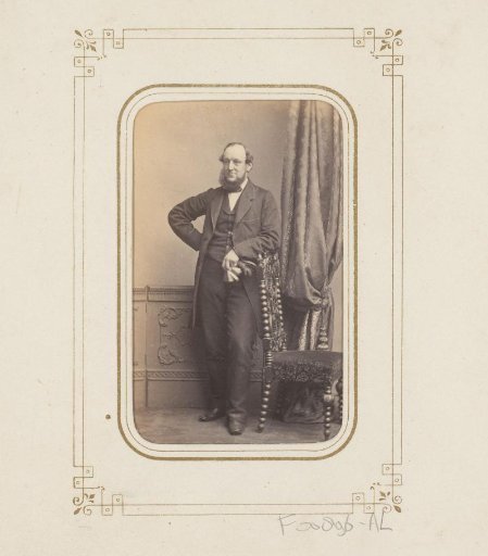 Portrait of a man, leaning on a chair