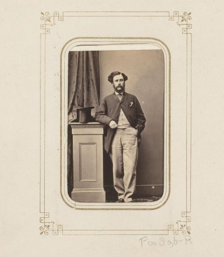 Portrait of a standing man with a beard