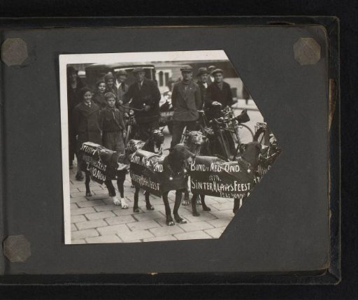 Dogs with advertising signs for the Sinterklaas campaign of the Union of Dutch Teachers in Amsterdam