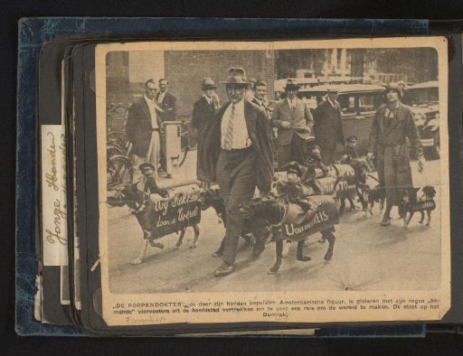 The Doll Doctor with His Advertising Dogs