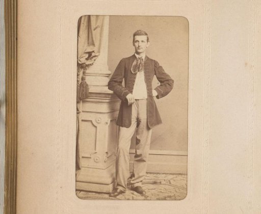 Portrait of a Man Standing by a Pillar