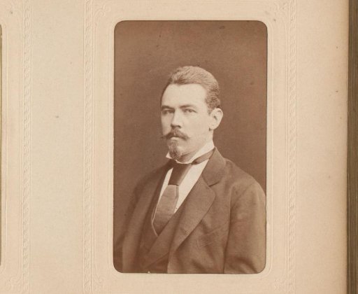 Portrait of a man with a mustache, sideburns, and a cravat