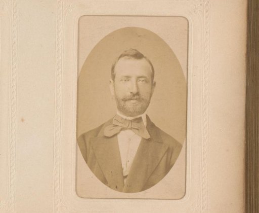Portrait of a man with moustache, beard and bow tie