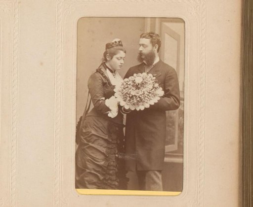 Portrait of a standing man and woman with a bouquet of flowers