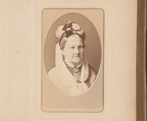Portrait of a woman with a headdress and a medallion