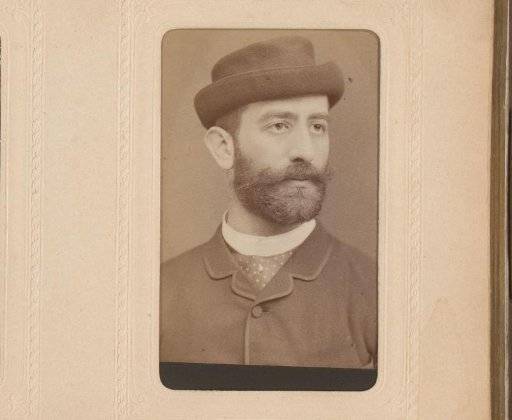 Portrait of a man with moustache, beard and hat