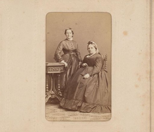 Portrait of a Standing Woman and a Seated Woman at a Table