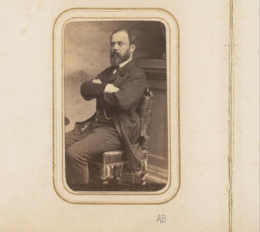 Portrait of a seated man with a beard