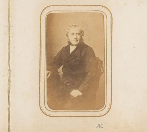 Portrait of a seated man with a beard