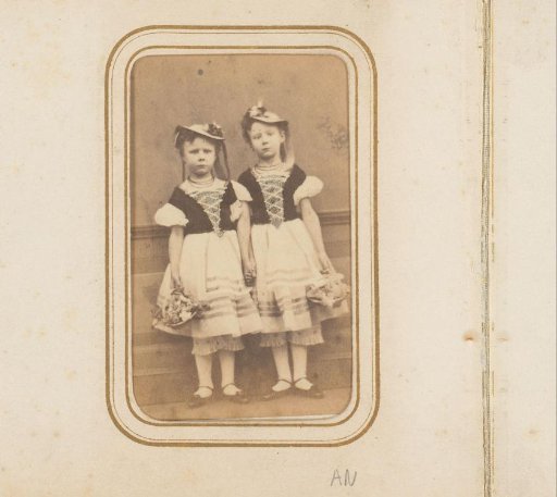 Portrait of two girls with hats and flowers