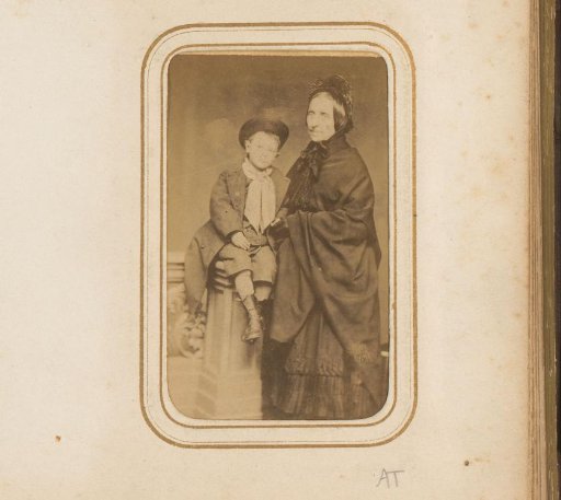 Portrait of a woman with a boy wearing a hat