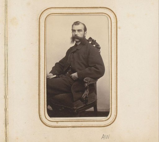 Portrait of a seated man with a mustache