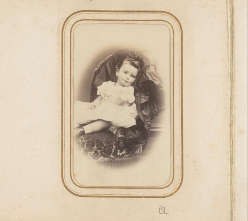 Portrait of a girl seated on a chair