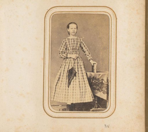 Portrait of a girl with an umbrella and an album