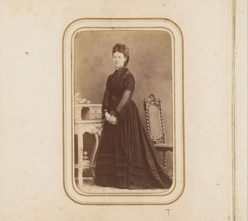 Portrait of a Standing Young Woman with a Book
