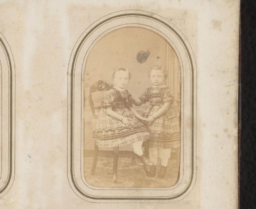Portrait of a seated girl and a standing girl