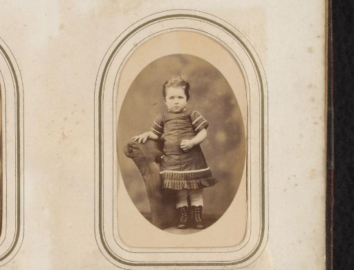 Portrait of a girl standing on a chair