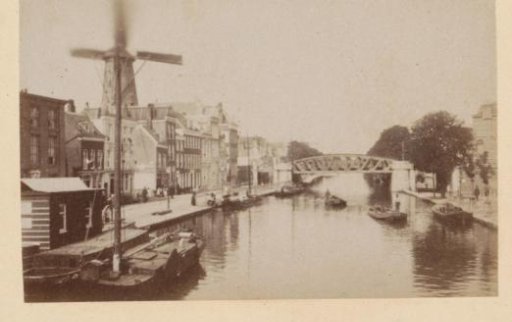 View of the Schiekade in Rotterdam with bridge and mill