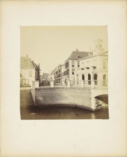 View of a street in Utrecht with the abutment of a bridge in the foreground