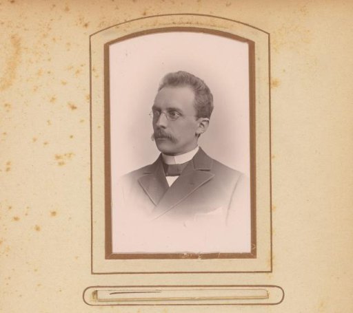 Portrait of a man with a moustache and spectacles