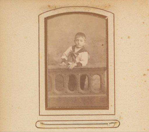 Portrait of a boy at a balustrade