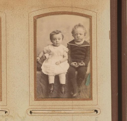 Portrait of two sitting toddlers