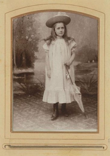 Portrait of a Standing Girl with Hat and Parasol