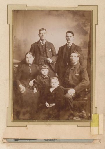 Family Portrait of a Woman, Men, and Children