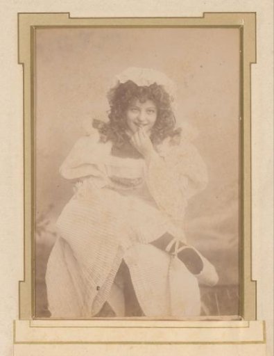 Portrait of a seated woman in a white dress