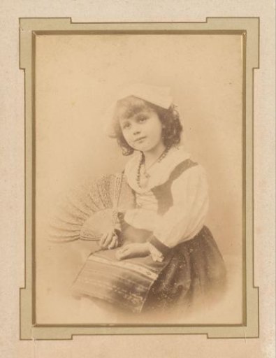 Portrait of a seated girl with a fan