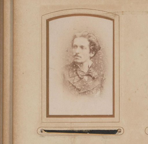 Portrait of a man with a mustache and bow tie