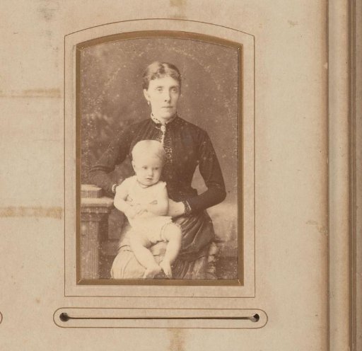 Portrait of a seated woman with a child on her lap