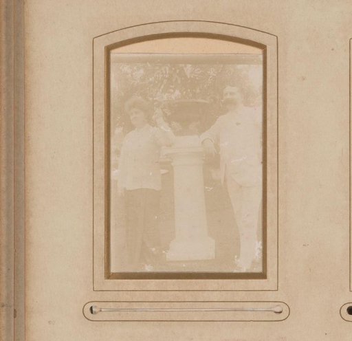 Portrait of a woman and a man, standing beside a pillar with a vase