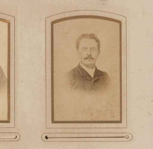 Portrait of a man with a mustache and spectacles