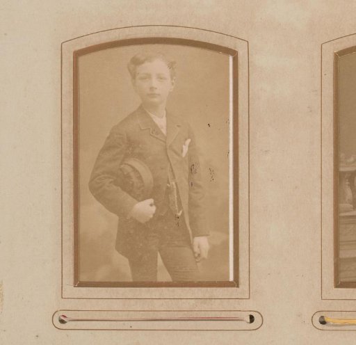 Portrait of a Standing Boy with a Cap Under His Arm