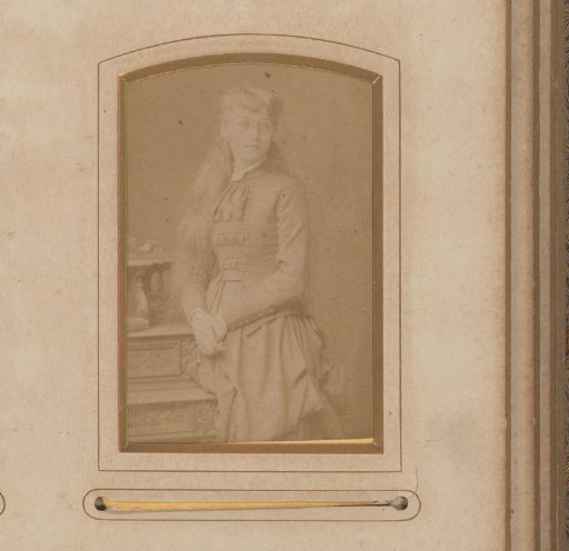 Portrait of a Girl Standing by a Writing Desk