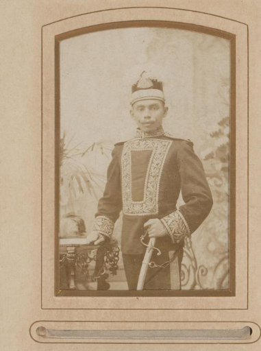 Portrait of a Man in Uniform with a Weapon