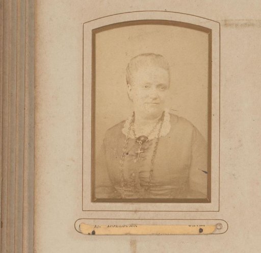 Portrait of a seated woman with a necklace