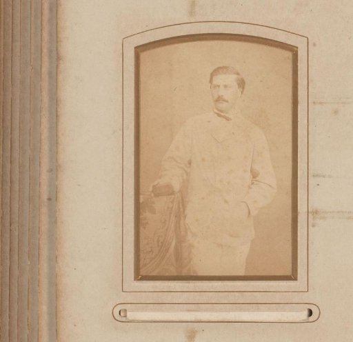 Portrait of a standing man with a moustache