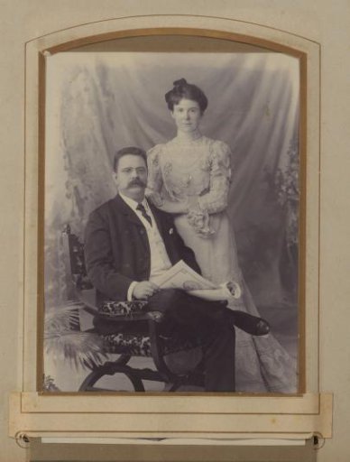 Portrait of a Seated Man Holding a Newspaper and a Standing Woman