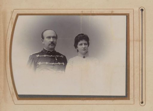 Portrait of a Man in Uniform and a Woman in a White Dress